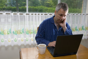 Businessman working from home in pajamas
